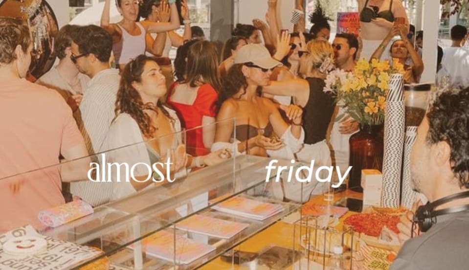 A crowded café-bar night, captioned “almost friday”