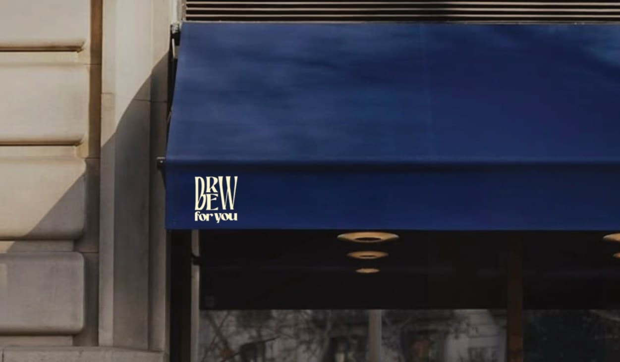 A navy café awning carrying the Brew for You logo