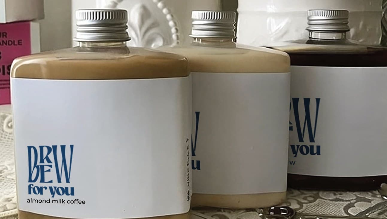 A row of Brew for You bottles: almond milk coffee, milk tea, and cold brew
