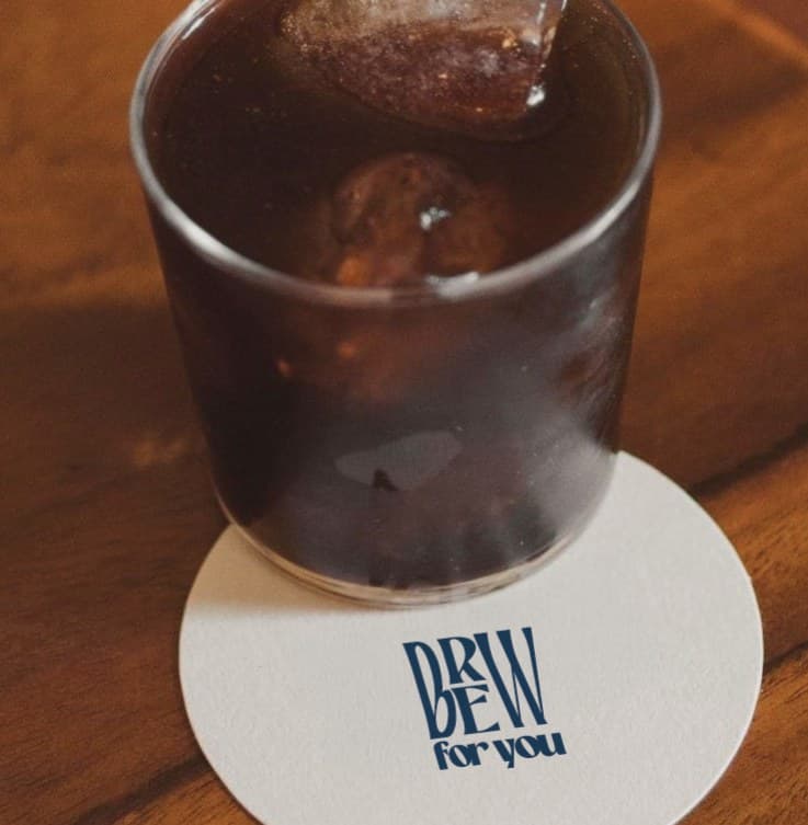 An iced coffee on a Brew for You coaster