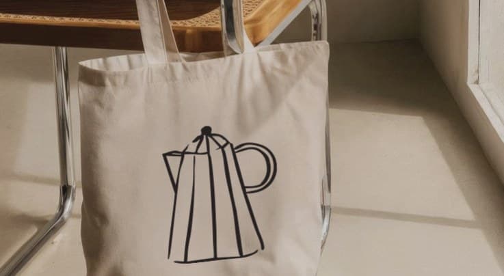 A canvas tote printed with a percolator illustration