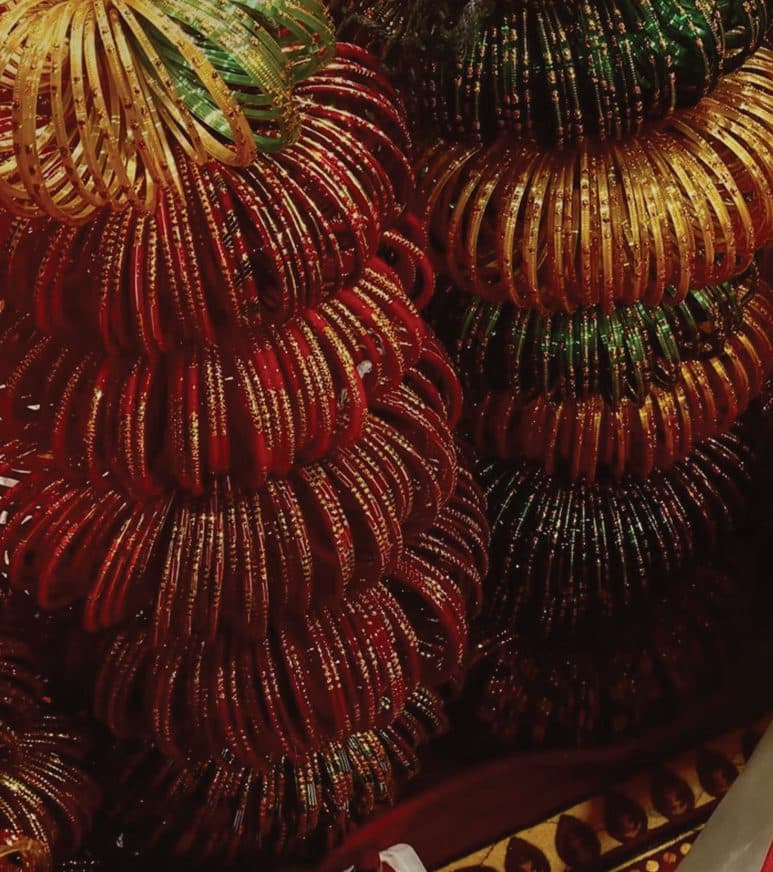 Stacks of red and green glass bangles