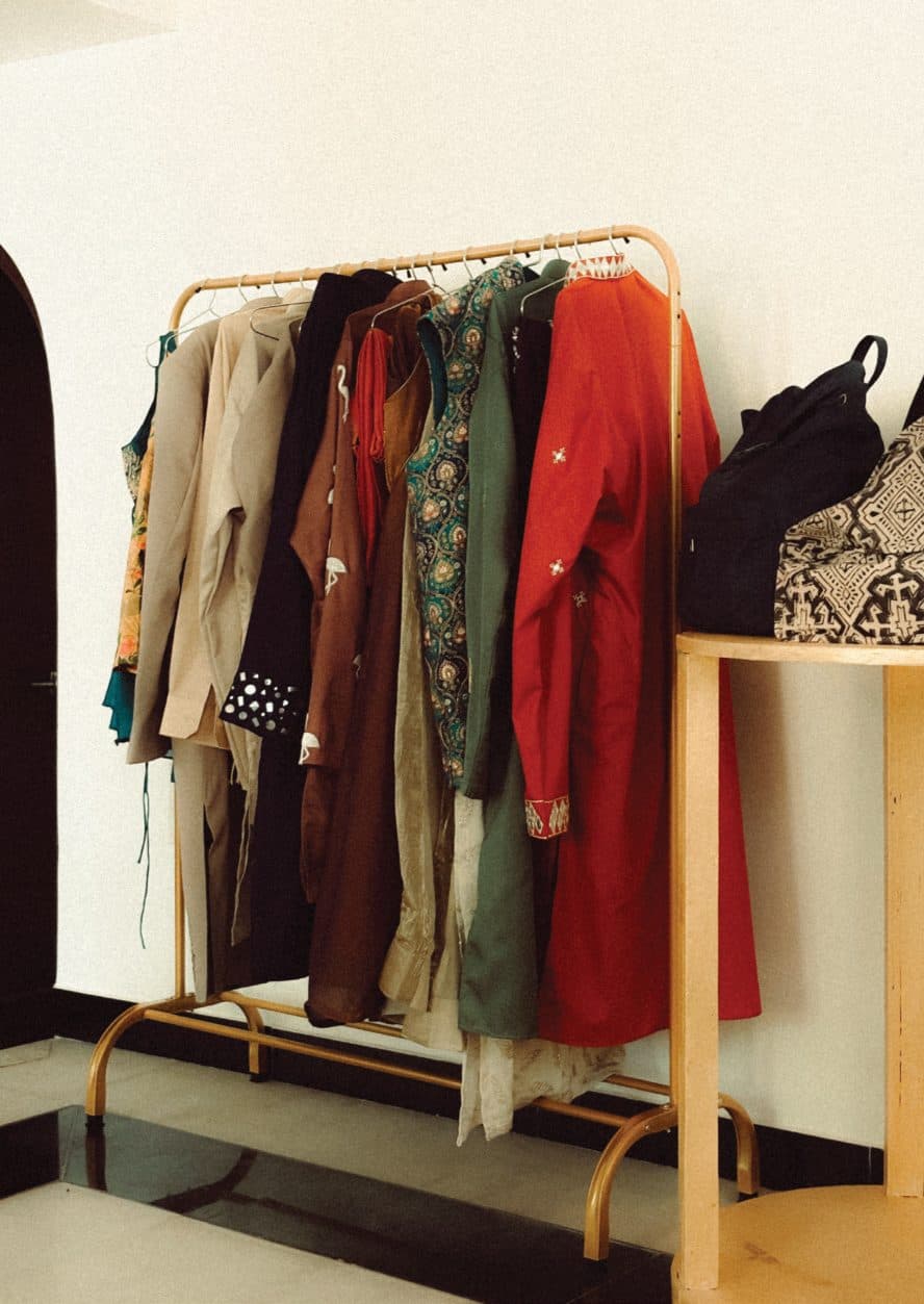 A rail of festive garments in a studio