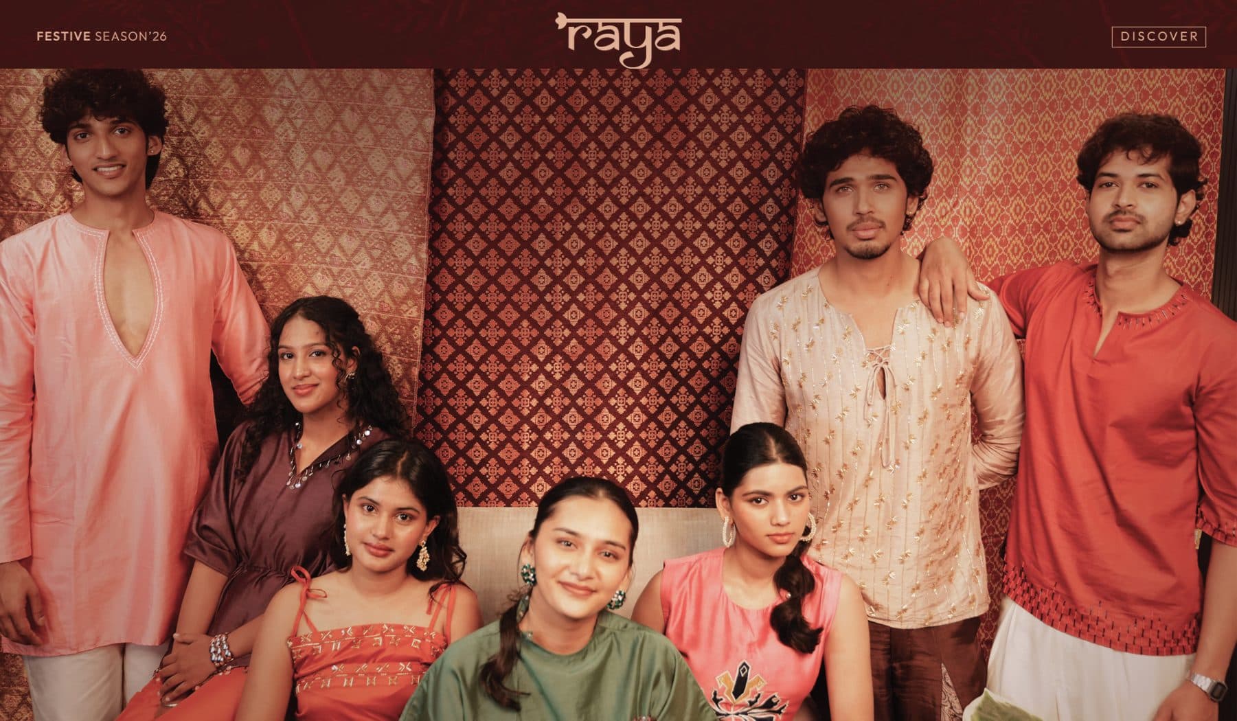 The Raya website’s festive-season banner: the Dhaaga cast before a patterned hanging