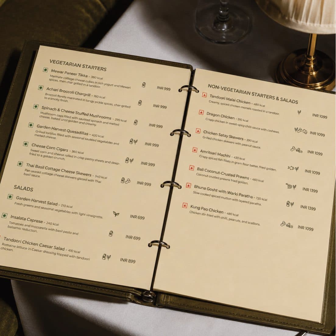 The open Surahi food menu in a ring binder, listing vegetarian and non-vegetarian starters