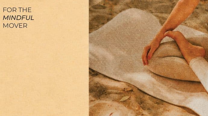A poster reading “For the mindful mover”, beside a woman stretching on a towel in the sand