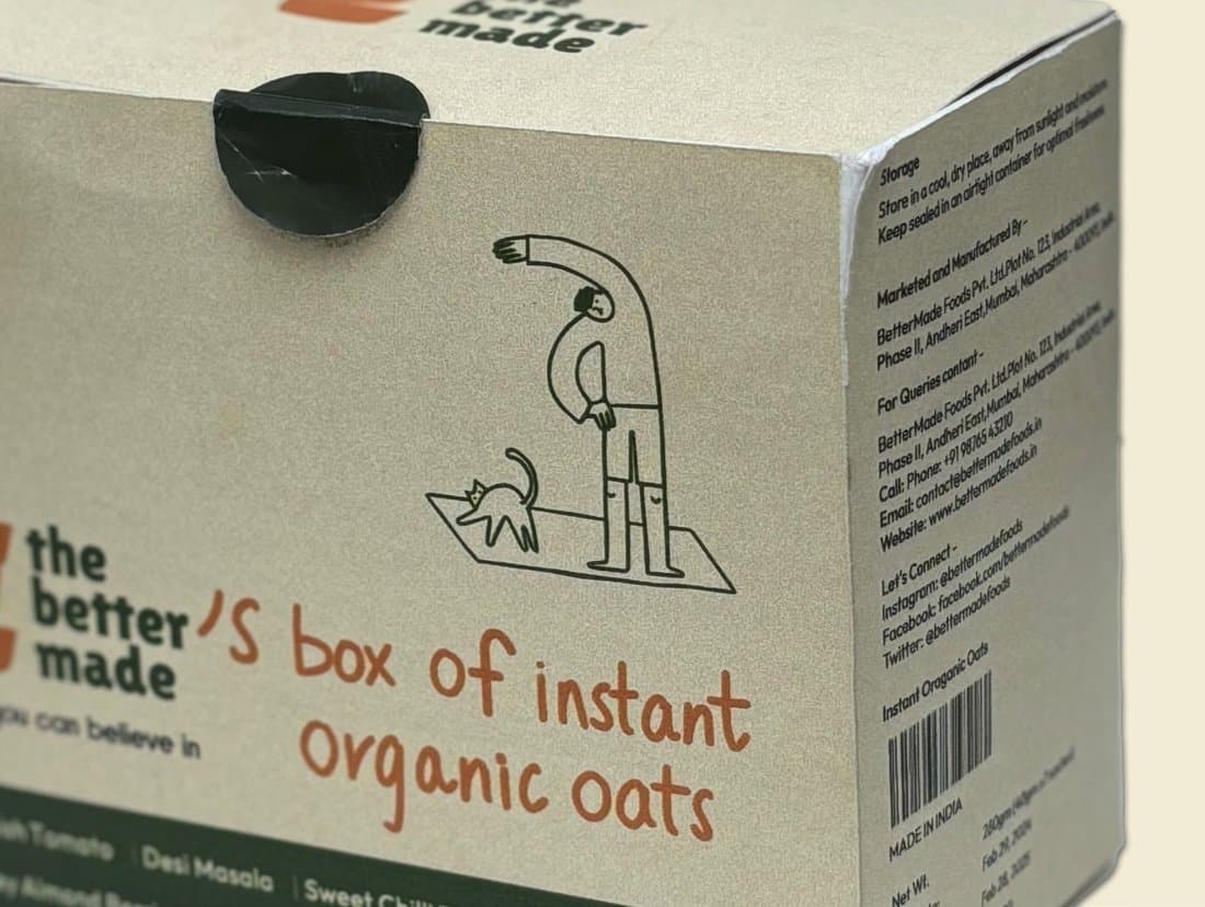 The side of the box: a line-drawn figure walking a cat, and “the better made’s box of instant organic oats”