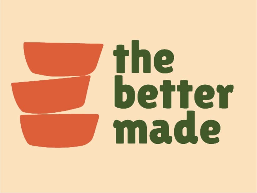 The Better Made logo, three stacked orange bowls beside the wordmark in green, on peach